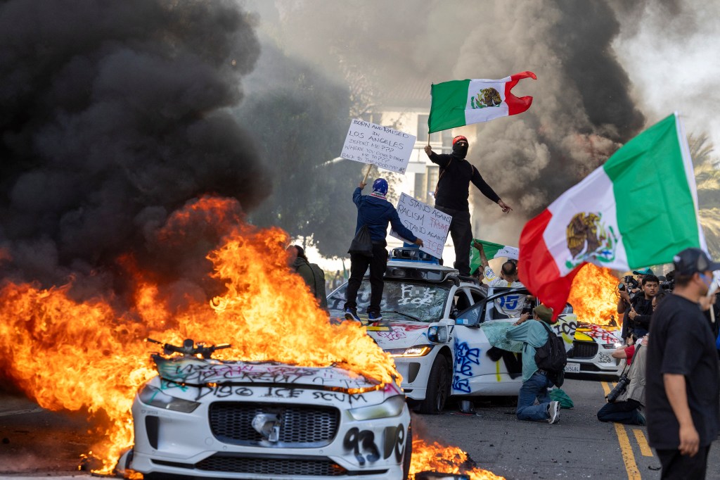media-demonstrators-wave-flags-atop-wrecked-106187189