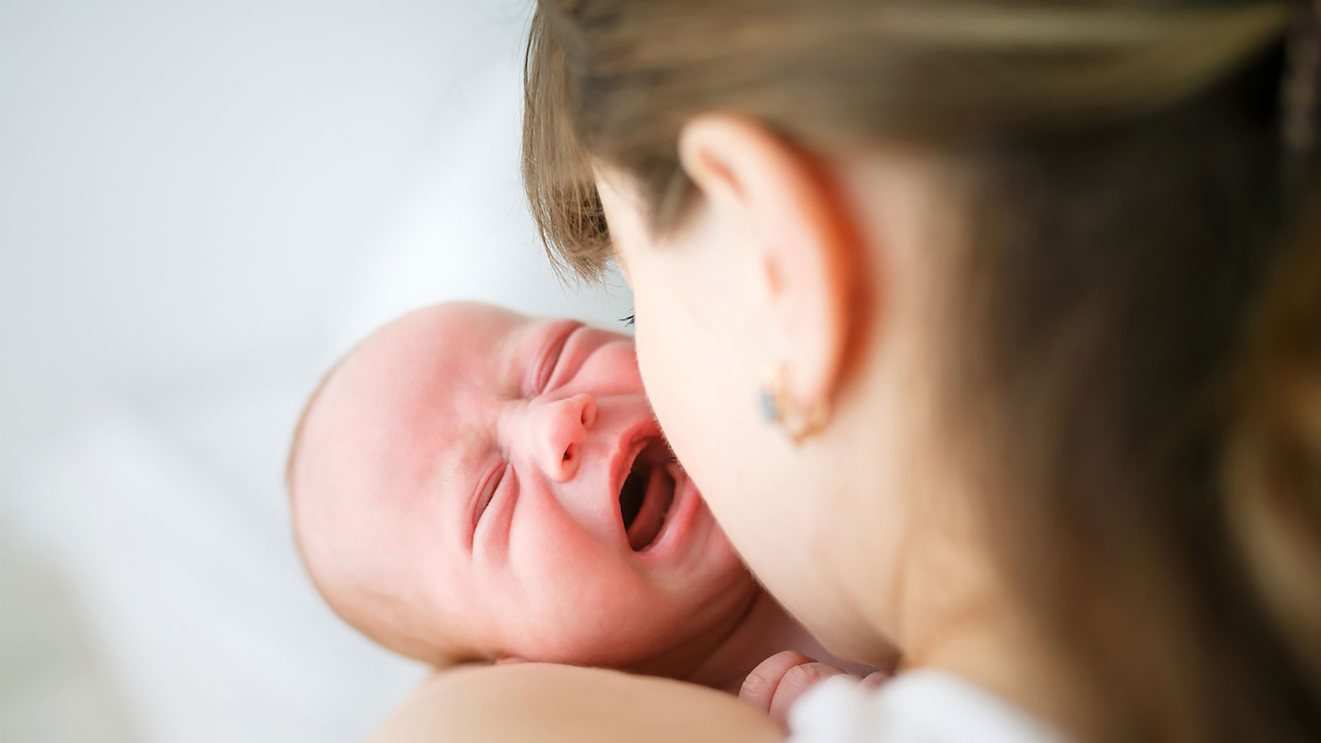 media-newborn-crying-in-mothers-arms
