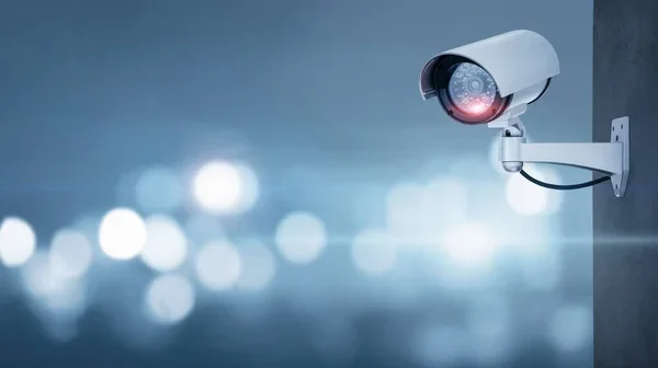 media-depositphotos_356520526-stock-photo-close-cctv-camera-defocused-background